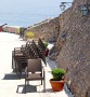 Кресло пластиковое плетеное Siesta Contract Ibiza, коричневый фото